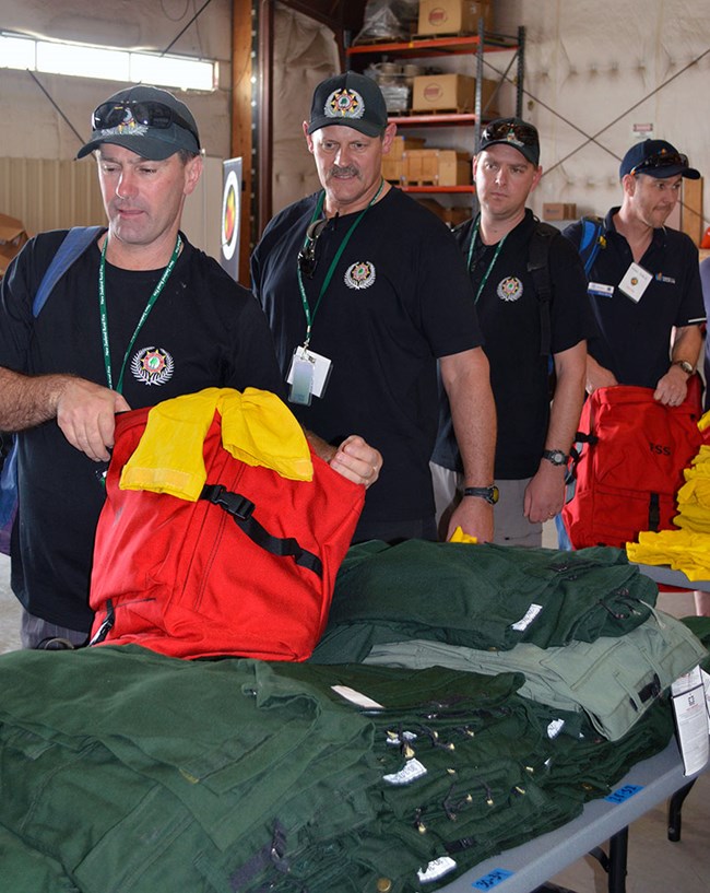 lt= New Zealand Fire Firefighters checking out fire equipment