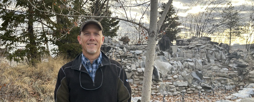 Russ Babiak Russ Babiak stands outdoors near trees and rocks.