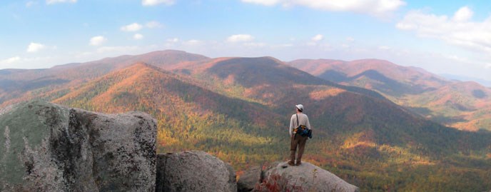 Hiker overlooking a mountain range