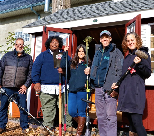 People holding gardening tools