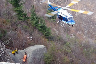 Park police rescuing a park vistor