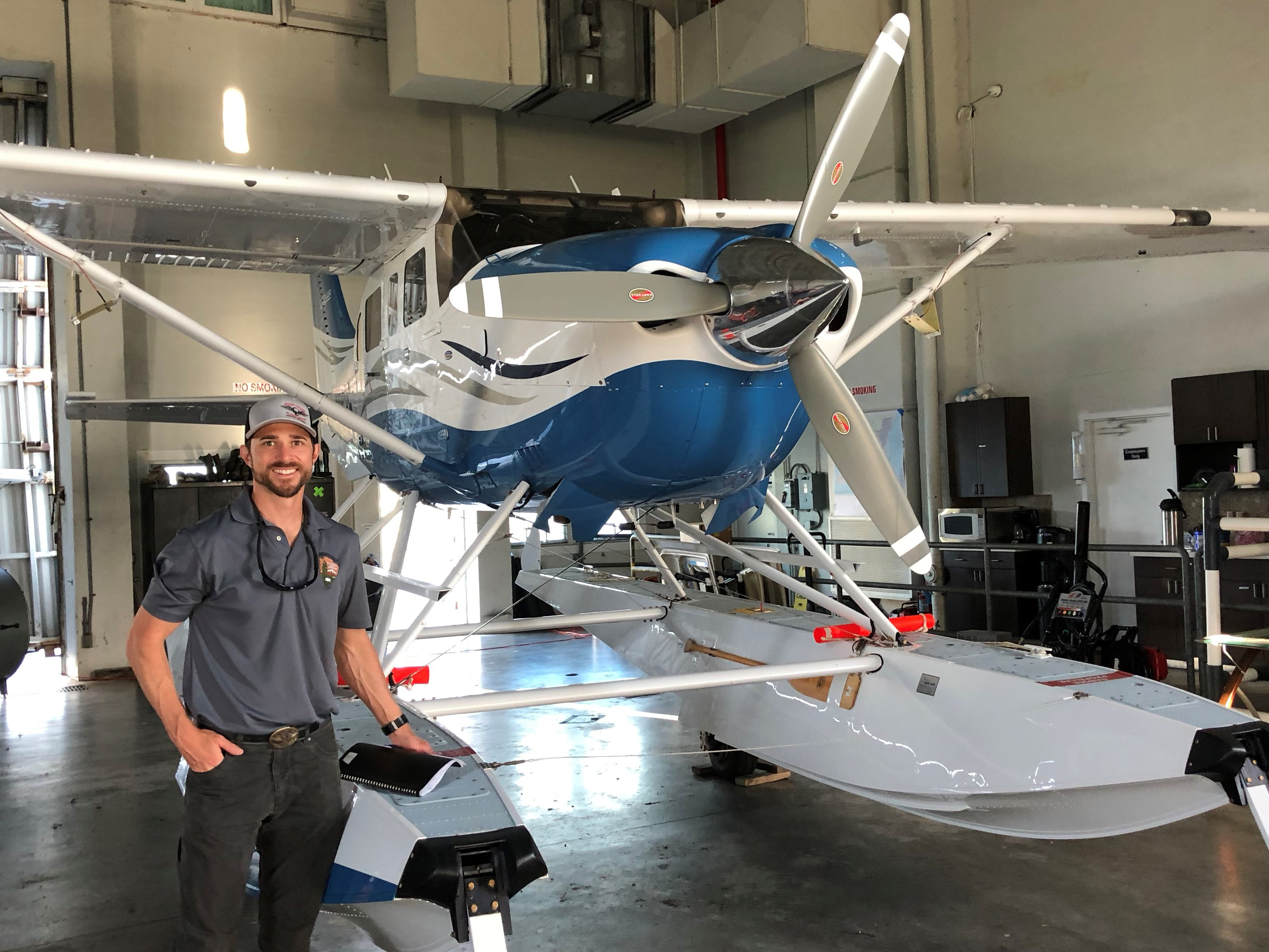 Justin Jager Aviation Manager Jager standing beside an airplane