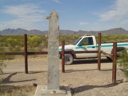 Boundary marker with vehicle barrier