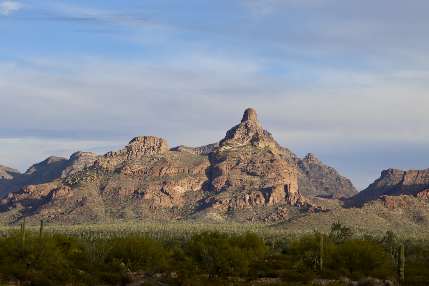 A mountain with unique layered structure in morning sunlight.