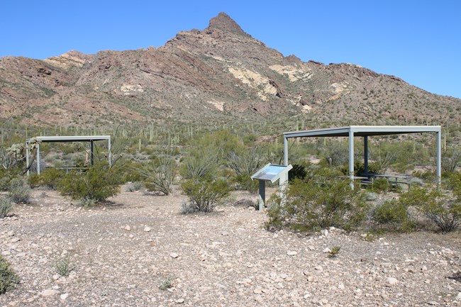 Pinkley Peak stands majestically in the background over several picnic tables and shade ramadas.