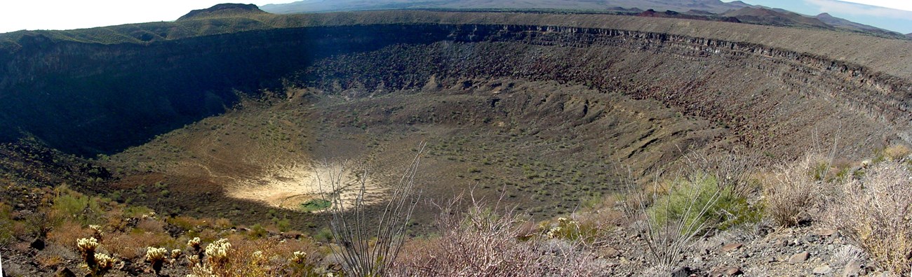 a view into a large crater atop a volcanic cinder cone in El Pinacate.