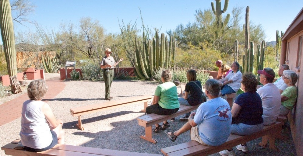 Ranger conducting a patio talk to a crowd at the visitor center Ranger conducting a patio talk to a crowd at the visitor center