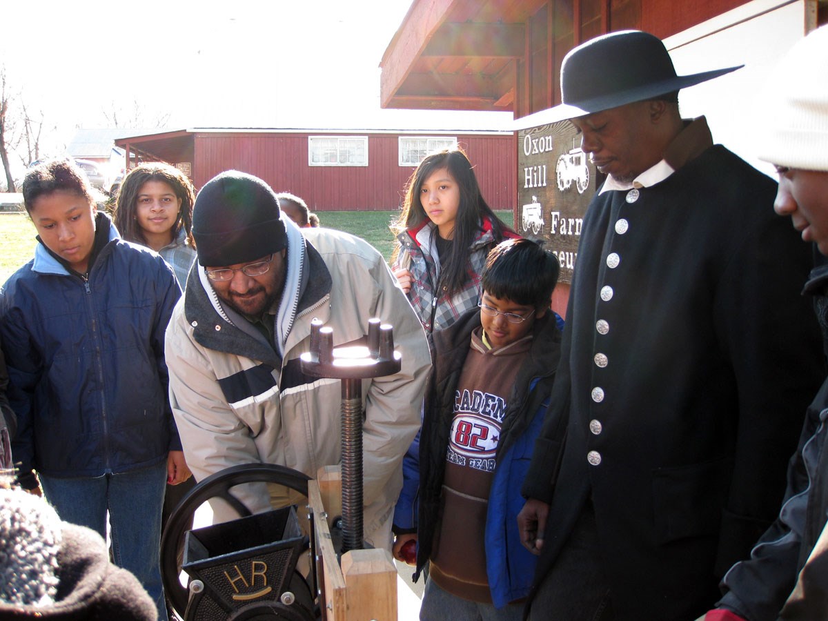 visitors pressing cider