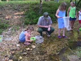 Bill O'Donnell in creek with kids Bill O'Donnell in creek with kids