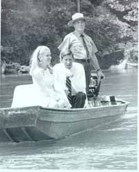 Tricia Nixon riding in a boat