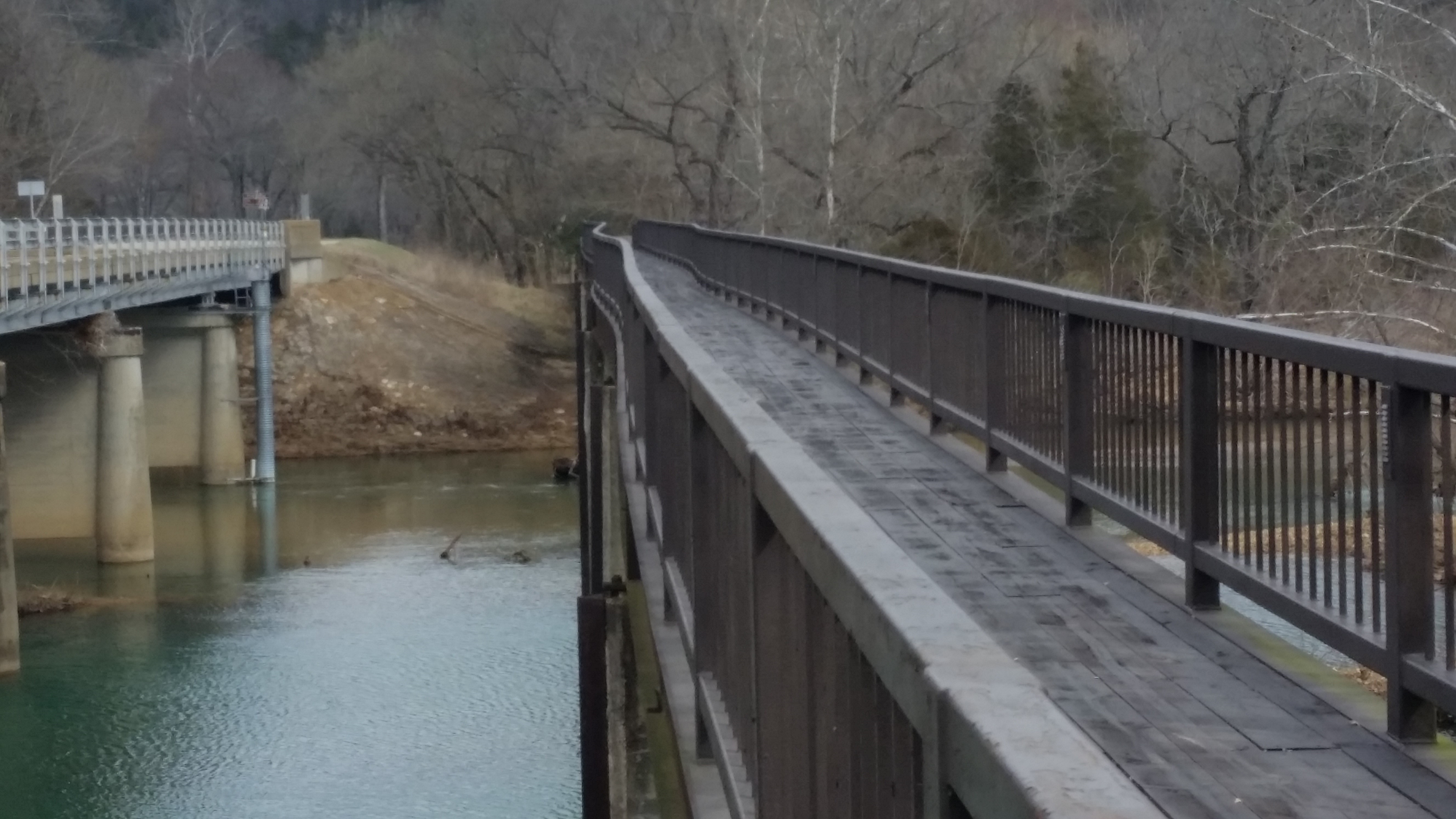 pedestrian bridge damaged by flood