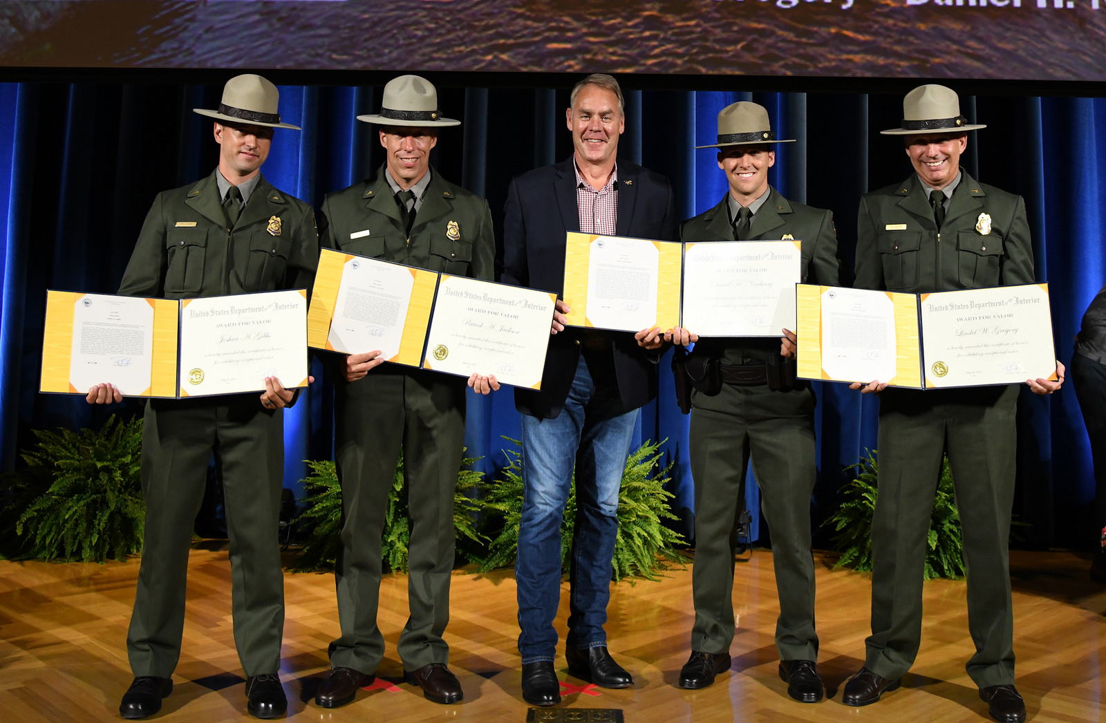 (From L to R) Park Rangers Joshua Gibbs, Patrick Jackson, Daniel Newberry and Lindel Gregory join Secretary Ryan Zinke (center) to receive their Valor Awards. (DOI Photo)