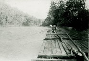 Tie raft floating down Current River