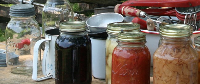 old fashioned can goods in glass on display