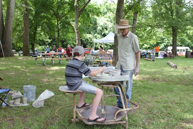 A potter teaches his art to future generations