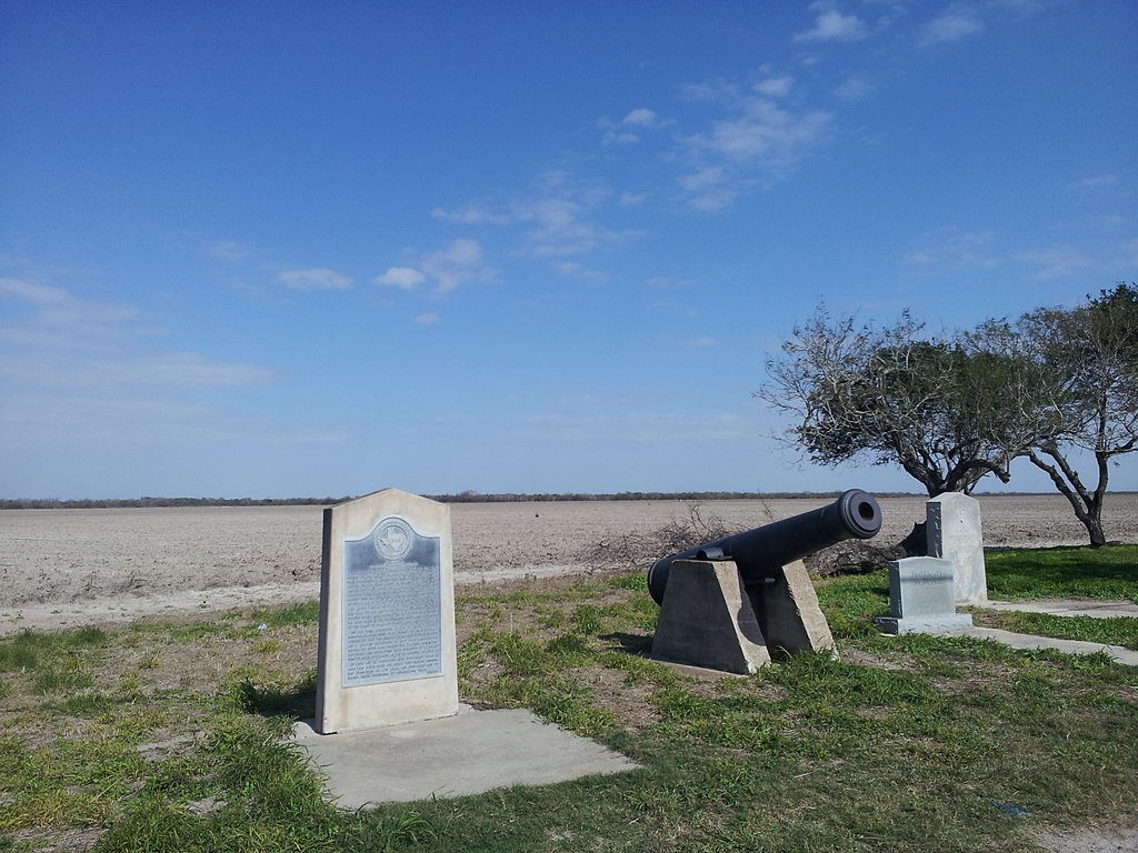 Historical marker and cannon memorializing the action at Carricitos