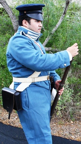 Living historian loading a musket
