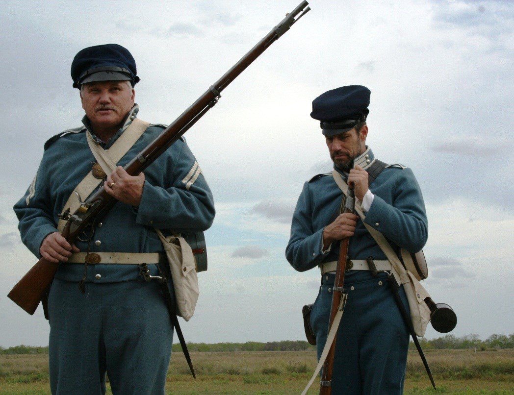 Living historians in Mexican War era U.S. infantry uniforms.