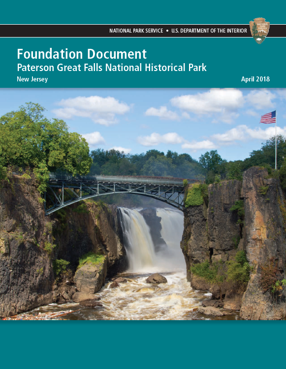 Teal cover of the 2018 Paterson Great Falls Foundation Document, showing the 77 ft. waterfall plunging between dark basalt cliffs framed by a black arched metal bridge