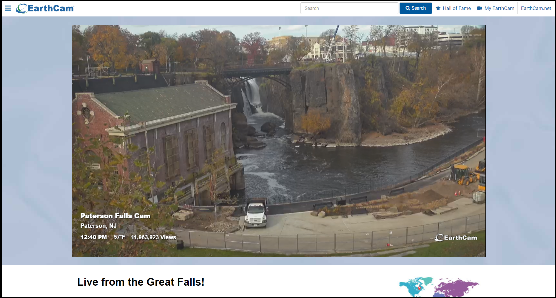 Screenshot of an Earthcam webpage showing the 77 ft. waterfall, arched metal bridge, & brick power plant at Paterson Great Falls