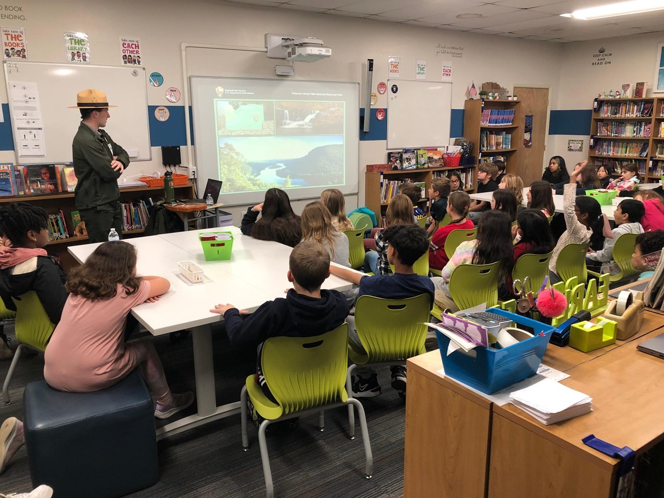 a ranger looking towards a smart board in a classroom