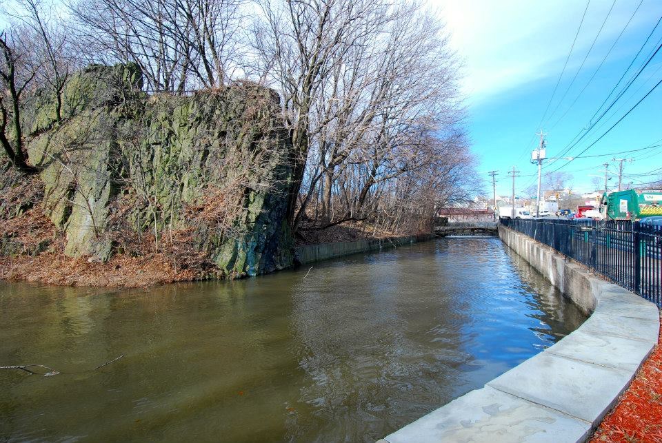 A view of the upper raceway filled with water from the Passaic River. A view of the upper raceway, a channel which brought water to power Paterson's factories.