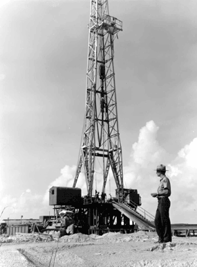 NPS ranger observing a natural gas well on Padre Island in the 1970s