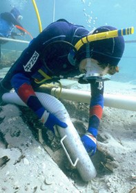 A marine archaeologist excavates the shipwreck site of 1554