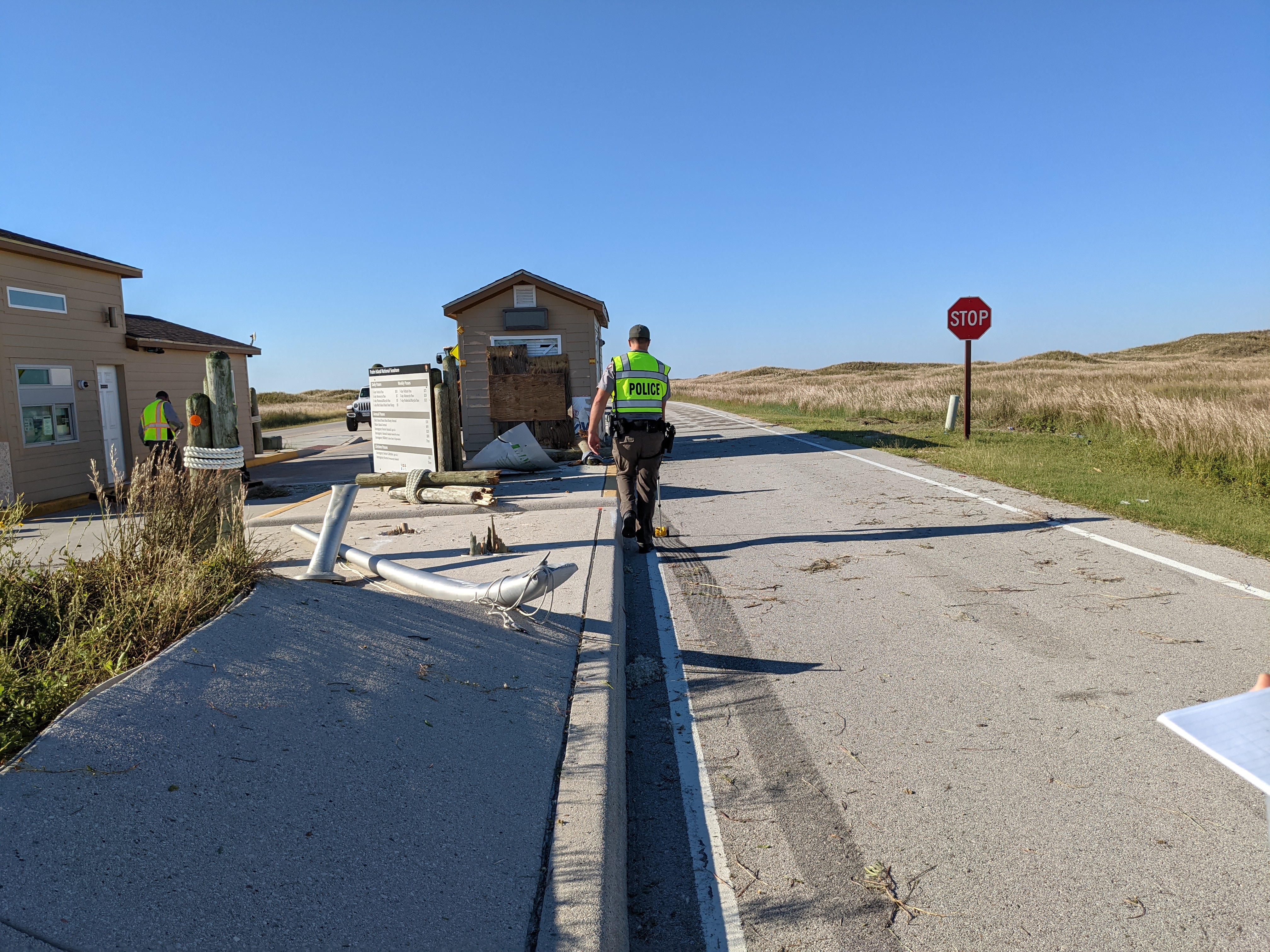 11.6.2021 Entrance Station Accident A law enforcement with a distance measuring tool measuring a skid mark at the accident scene.