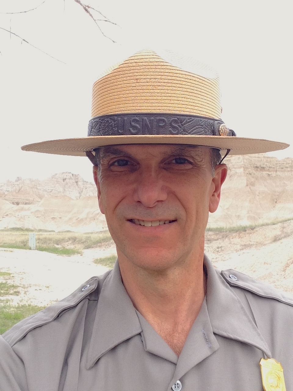 A headshot of Eric Brunnemann in park uniform