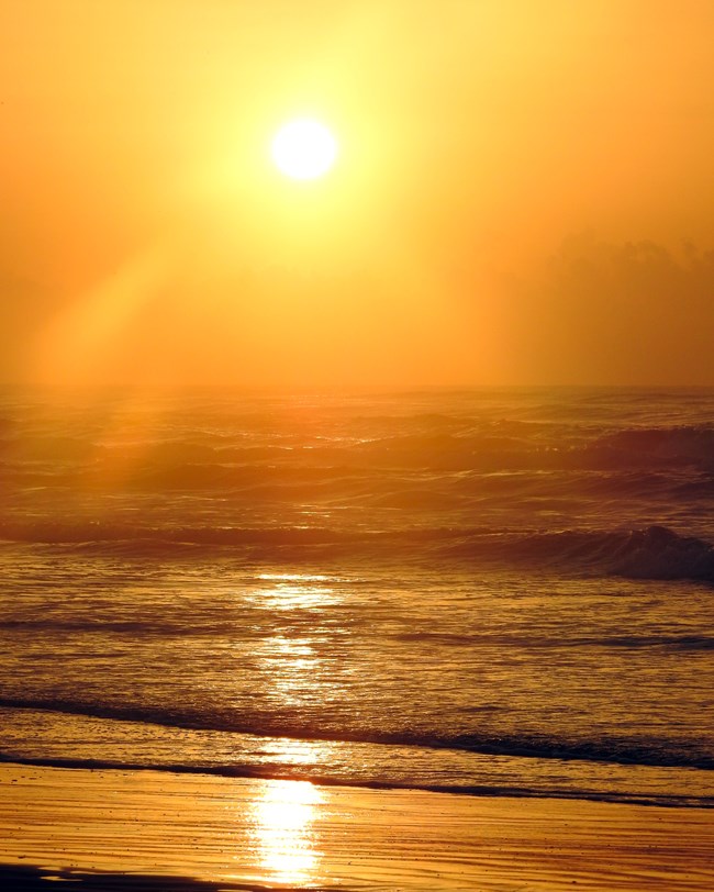 Golden sunrise at Malaquite Beach Golden sunrise at Malaquite Beach