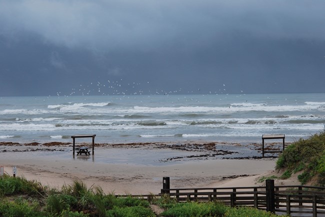Storm clouds and rough surf along Padre Island.