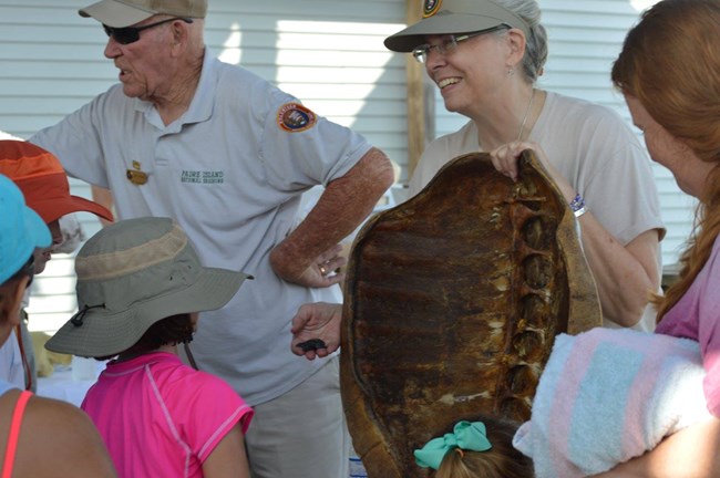 Volunteers teach visitors about Kemp's ridley sea turtles Volunteers teach visitors about Kemp's ridley sea turtles