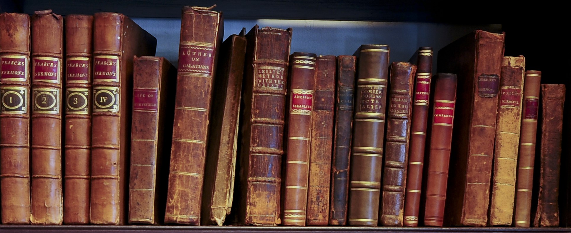A color photo of showing some of the original books in Bishop White's study.