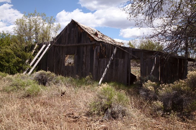 Oak Grove ranch house The old wooden slats of Oak Grove ranch house being held up with support braces.