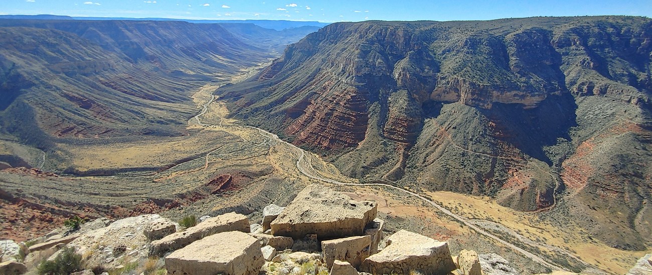 A wide desert canyon slopping toward the Grand Canyon.