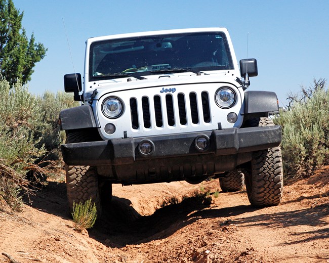 Jeep on deeply rutted road