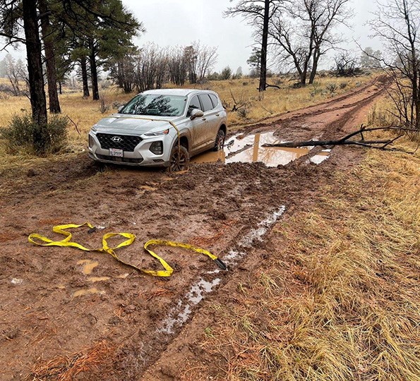 Twin Point Rental Car stuck in mud