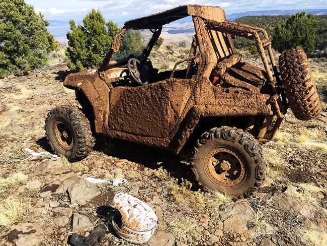 UTV side by side covered in spring mud