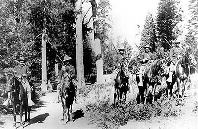 This is an image of five black soliders on their horses with their shotguns hanging from their backs at National Park