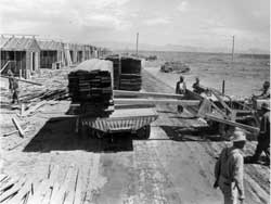 Unloading lumber at the Poston site