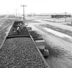 Evacuees unloading coal at Rohwer