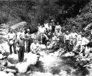 Caucasian staff and Japanese American internees take a break at the Kooskia Work Camp