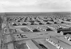 evacuee barracks and outhouses, Granada