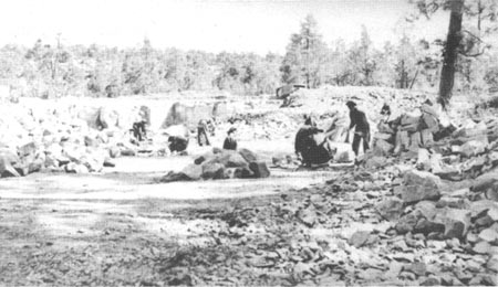 CCC enrollees quarrying rock