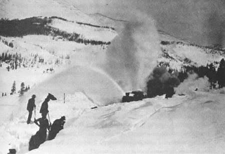 clearing snow along railroad tracks