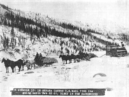 horses hauling mail and a locomotive