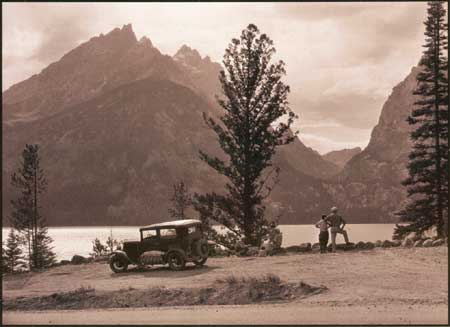 tourists with car a scenic overlook along lake