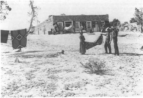 John Hubbell holding rug