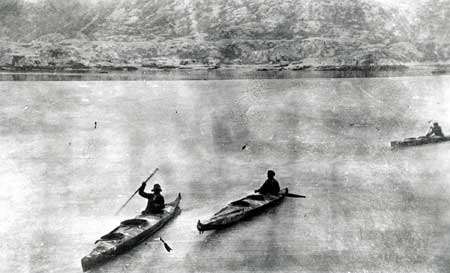 Native Americans in kayaks